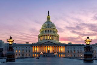 The United States Capitol Building at sunset in Washington DC, USA.