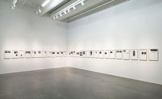 Floating images of the Moon-obscured sun – the black-and-white broadsheets on the exhibition wall