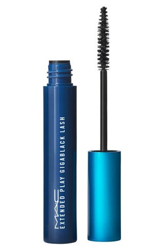 Mac Extended Play Gigablack Lash Mascara open beside its applicator on a white background