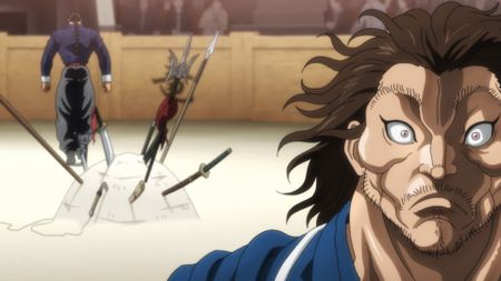 A character stood in front of a pile of weapons in BAKI-DOU: The Invincible Samurai.