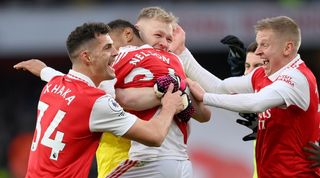 Arsenal players celebrate Reiss Nelson's late winner against Bournemouth at the Emirates Stadium in March 2023.