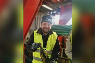 Peter Lindberg from the Swedish dive team Ocean X, with one of the hundreds of bottles recovered from the wreck of the Kyros.