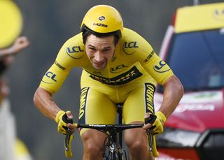 Team Jumbo rider Slovenias Primoz Roglic wearing the overall leaders yellow jersey crosses the finish line at the end of the 20th stage of the 107th edition of the Tour de France cycling race a time trial of 36 km between Lure and La Planche des Belles Filles on September 19 2020 Photo by Marco BERTORELLO AFP Photo by MARCO BERTORELLOAFP via Getty Images