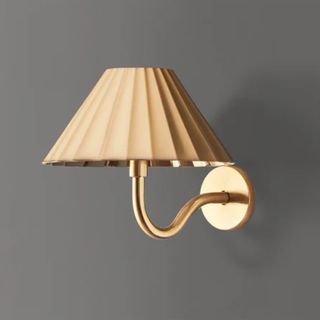 gold wall lamp part of the new pooky rechargeable lighting collection