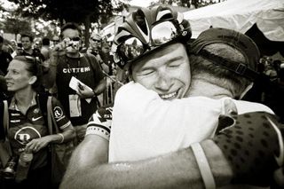 Ben King hugs his dad after winning the 2010 US pro road race championship.
