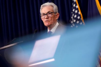 US Federal Reserve Chair Jerome Powell speaks at podium after Fed meeting January 2024