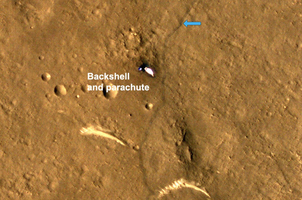 This zoomed-in section of HiRISE’s imagery of China's Mars rover Zhurong and its tracks, captured on March 11, 2022, shows that the rover inspected the backshell and parachute that helped it land safely in May 2021.