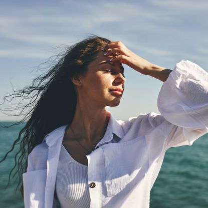 woman on the beach by the ocean