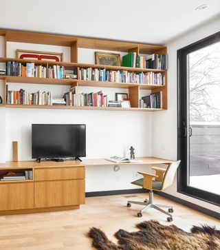 A home office with shelving and storage solutions