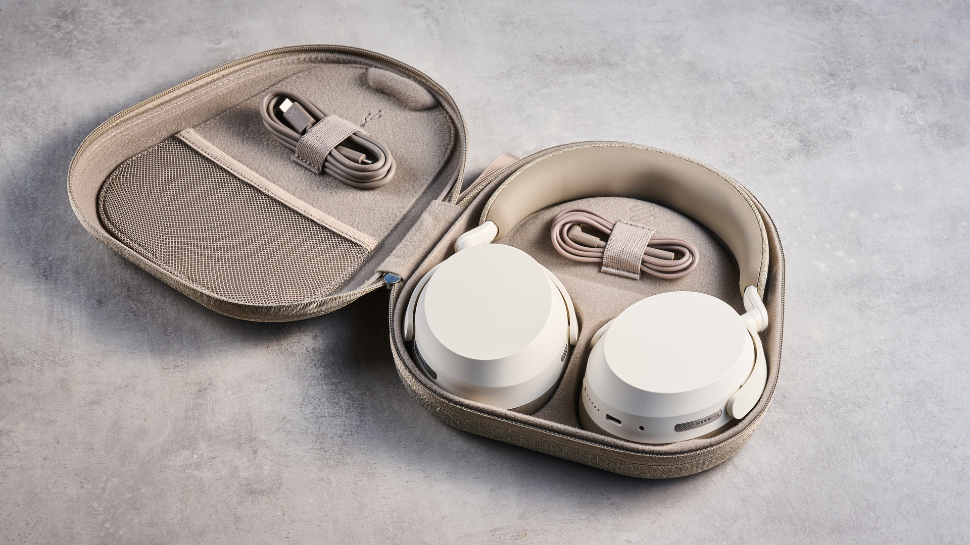the sennheiser momentum 5 in white photographed against the blue tom's guide background