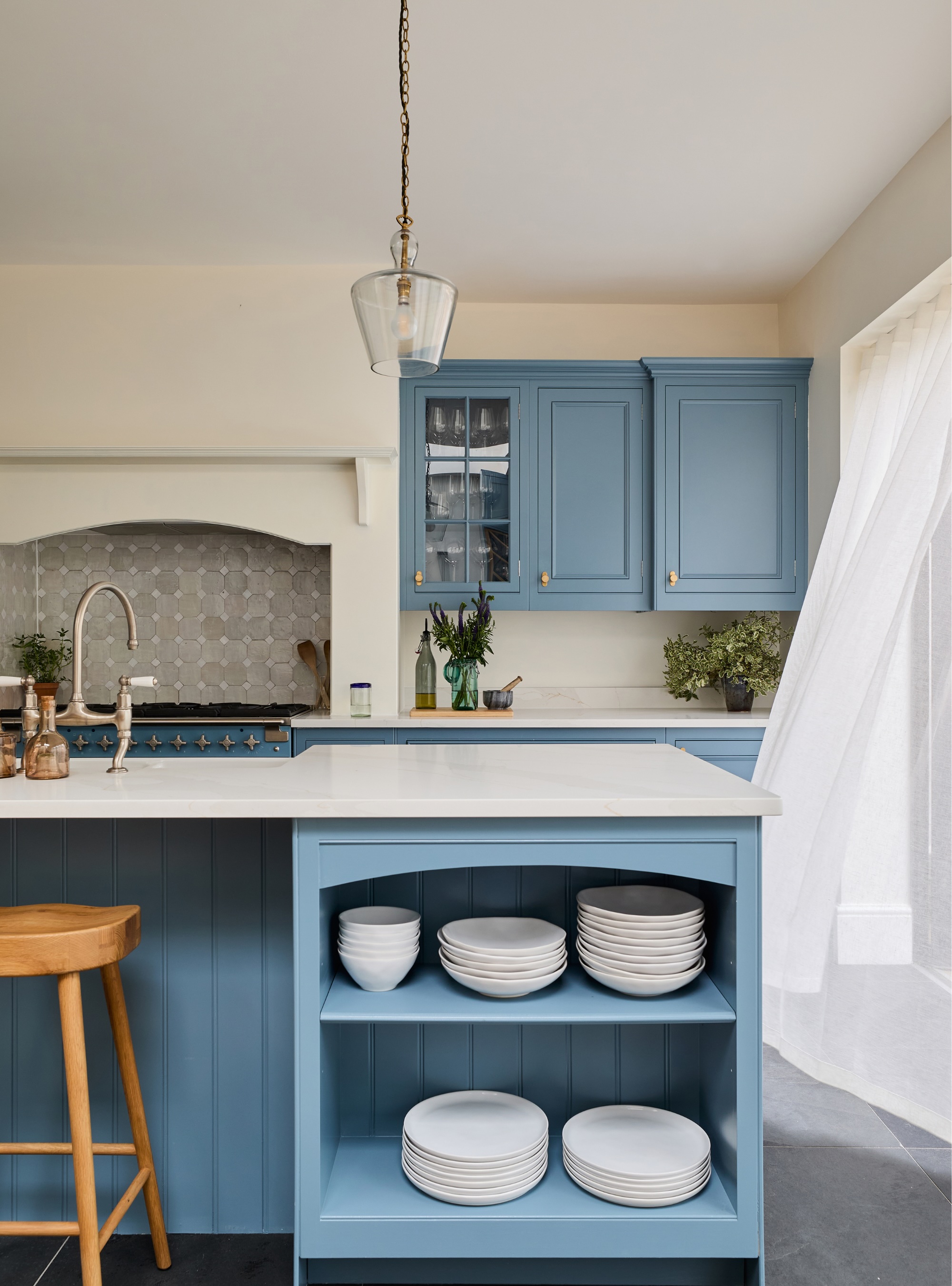 Powder blue kitchen island with open shelving