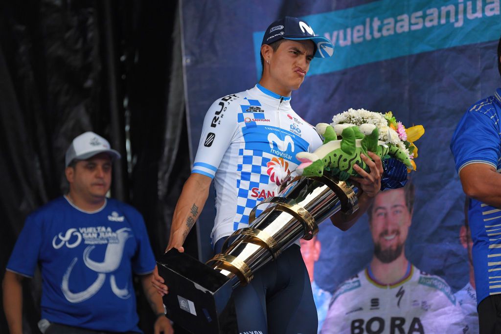 Winner Anacona carries his trophy