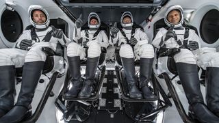 The crew of Axiom Space's Ax-1 mission pose for a photo inside a SpaceX Crew Dragon spacecraft while training. They are: (from left) Mark Pathy; Larry Connor; Michael López-Alegría; and Eytan Stibbe.