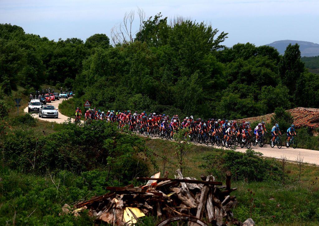 LAGUNAS DE NEILA SPAIN MAY 22 A general view of the peloton competing during the 7th Vuelta a Burgos Feminas 2022 Stage 4 a 1251km stage from Covarrubias to Lagunas de Neila 1867m VueltaBurgos BurgosFem UCIWWT on May 22 2022 in Lagunas de Neila Spain Photo by Gonzalo Arroyo MorenoGetty Images