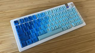 Glorious GMMK 3 gaming keyboard with full RGB on sitting on a wooden gaming desk