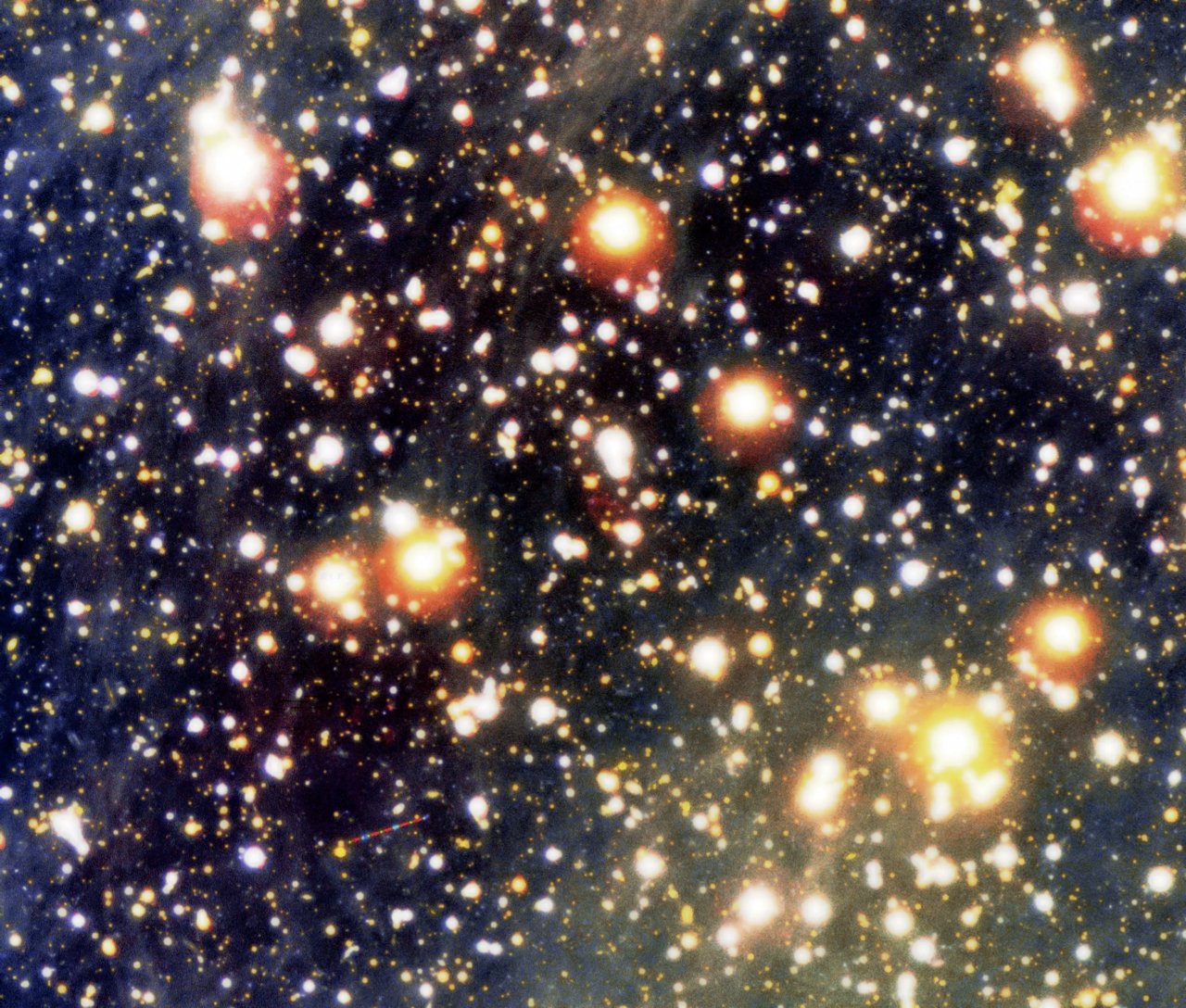 This Very Large Telescope image is a color composite view of the the sky field around the lonely neutron star RX J1856.5-3754 (in the exact center of image) and the related cone-shaped nebula. The trail of an asteroid is seen in the field with intermitten