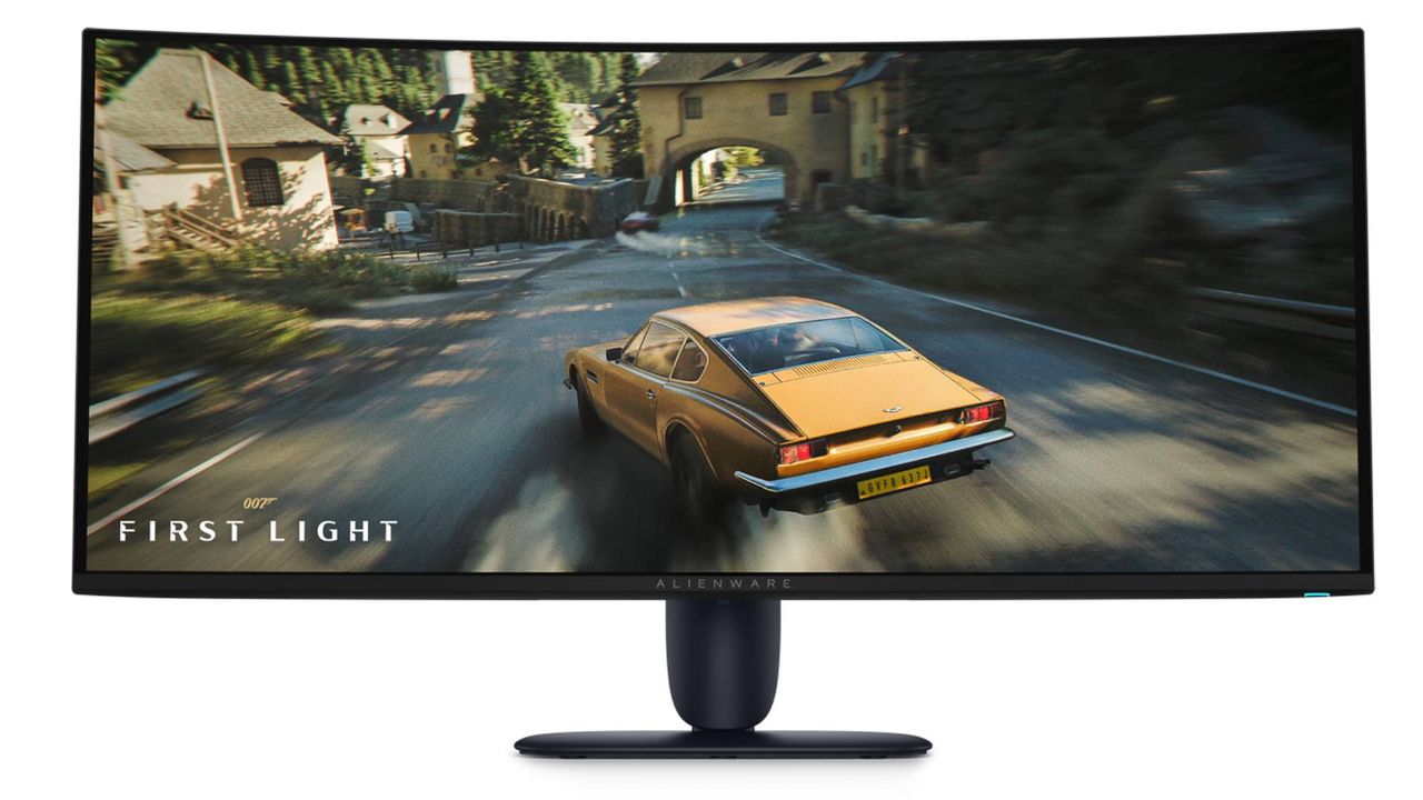 Alienware AW3426DW monitor with 007: First Light driving segment on screen.