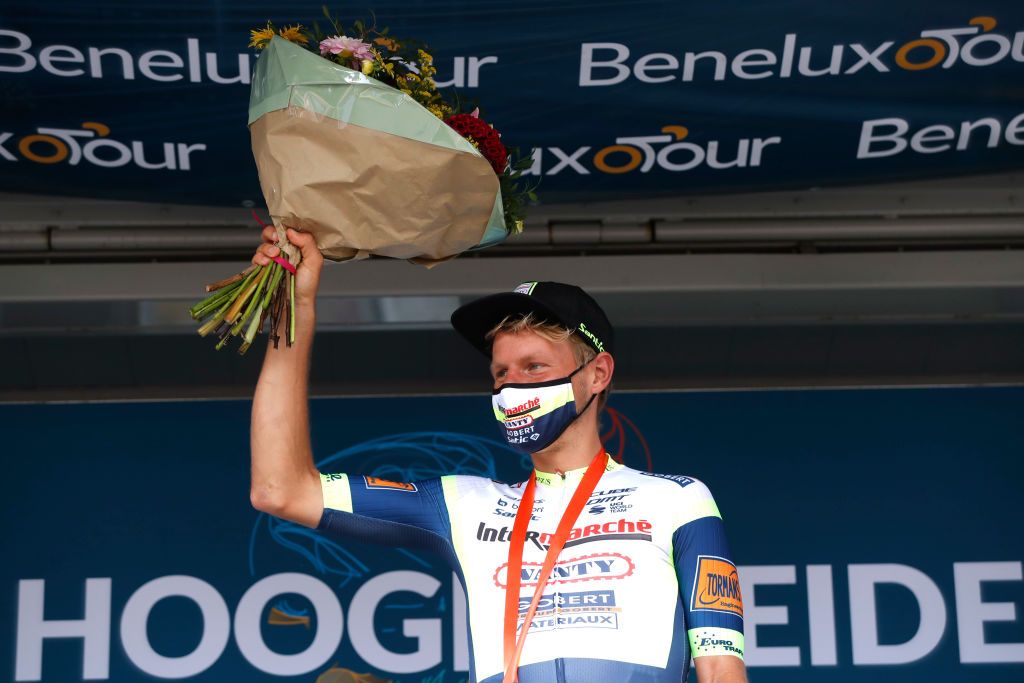 HOOGERHEIDE NETHERLANDS SEPTEMBER 01 Taco Van Der Hoorn of Netherlands and Team Intermarch Wanty Gobert Matriaux celebrates at podium as stage winner during the 17th Benelux Tour 2021 Stage 3 a 1683km stage from Essen to Hoogerheide BeneluxTour on September 01 2021 in Hoogerheide Netherlands Photo by Bas CzerwinskiGetty Images