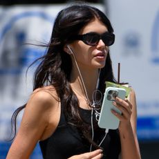 Kaia Gerber was spotted wearing the track shorts trend with ballet flats