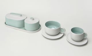 Young Chinese studio Suomu Design exhibited its dynamic ceramic collections. A range of crockery in white and light green.
