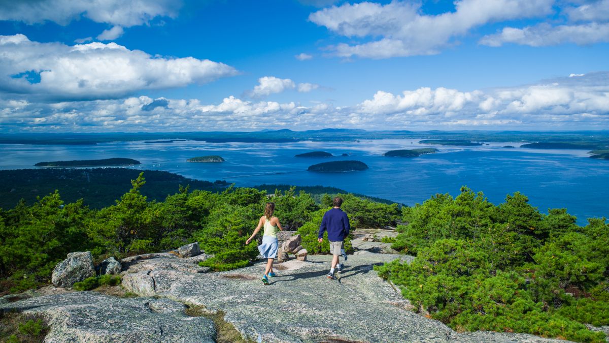 USA, Maine, Mt. Desert Island, AHikers atop Gorham Mountain, Acadia National park