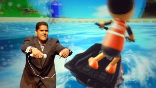 Reggie Fils-Aimé engrossed in an intense session of Wii Sports Resort