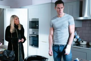 Sharon Watts and Zack Hudson with a bandage on his hand