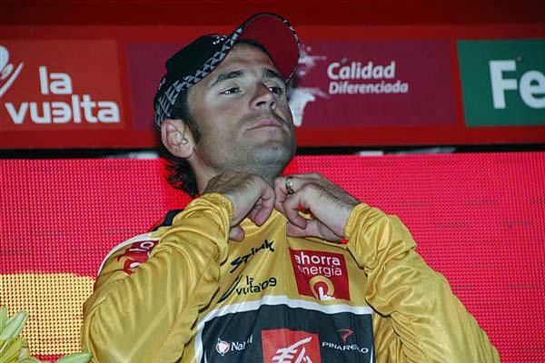 Alejandro Valverde (Caisse d'Epargne) pulls on another gold jersey as the race leader.