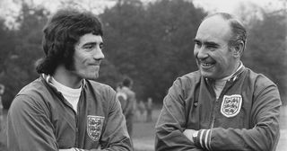 English footballer Kevin Keegan (left) with England team manager Alf Ramsey (1920 - 1999) during a training session for the FIFA World Cup qualifying match against Wales at Wembley, UK, 24th January 1973.