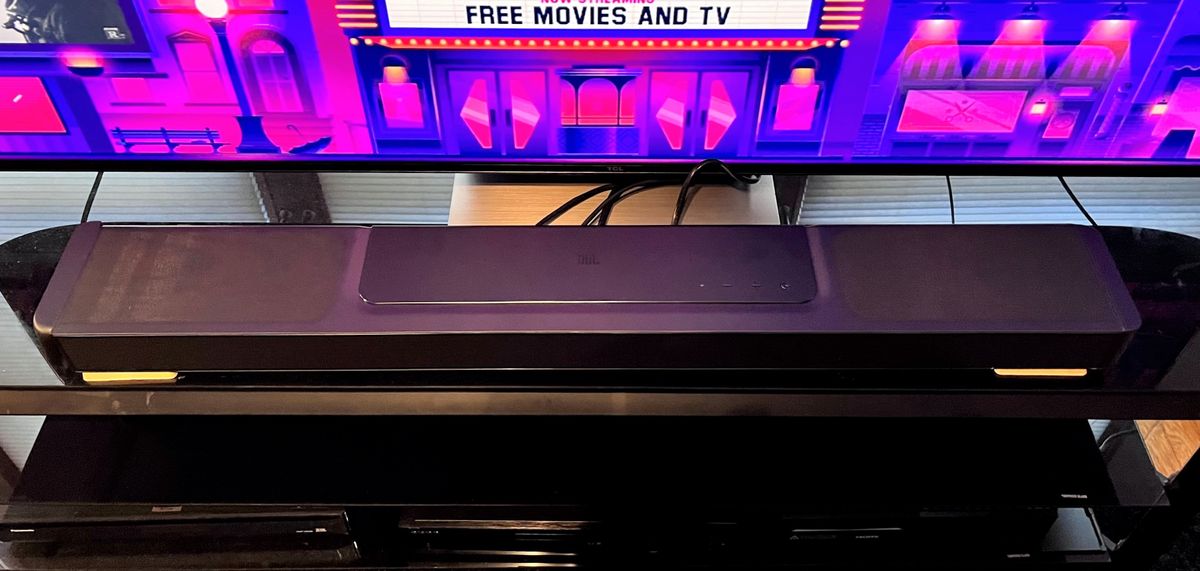 JBL Bar 1300X soundbar on TV stand