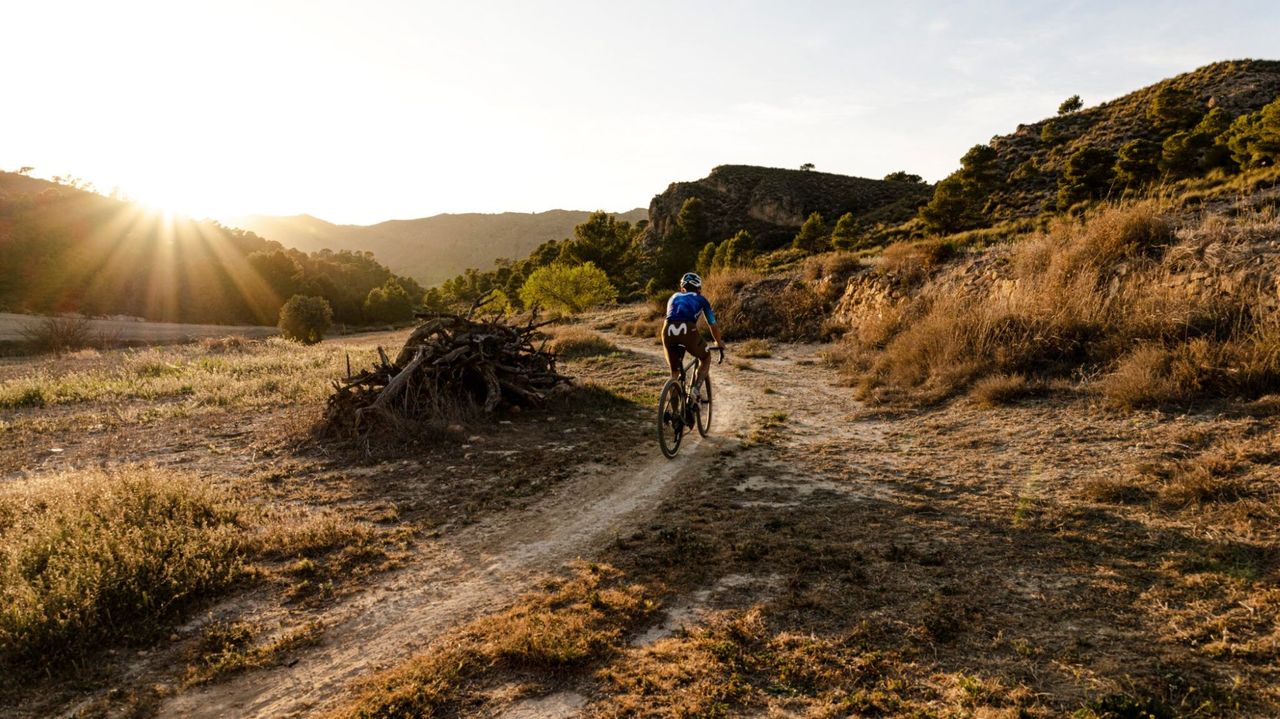 Alejandro Valverde riding a gravel bike on a gravel track