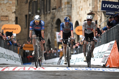 SAN GIMIGNANO, ITALY - MARCH 10: (L-R) Stage winner Mathieu van der Poel of Netherlands and Team Alpecin-Premier Tech, Giulio Pellizzari of Italy and Team Red Bull - BORA - hansgrohe and Isaac Del Toro of Mexico and UAE Team Emirates - XRG cross the finish line during the 61st Tirreno-Adriatico 2026, Stage 2 a 206km stage from Camaiore to San Gimignano 332m / #UCIWT / on March 10, 2026 in San Gimignano, Italy. (Photo by Tim de Waele/Getty Images)