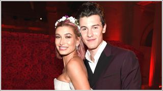 Shawn Mendes (R) and Hailey Baldwin hug and pose together as they attend the Heavenly Bodies: Fashion & The Catholic Imagination Costume Institute Gala at The Metropolitan Museum of Art on May 7, 2018 in New York City.