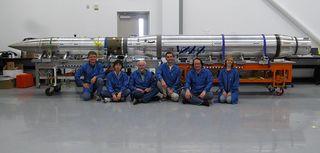 The FOXSI solar telescope team sits in front of the integrated payload before it gets ready for launch (from left to right: Paul Turin, Shinya Saito, Stephen McBride, Steven Christe, Säm Krucker, Lindsay Glesener). The rocket launched on Nov. 2, 2012.