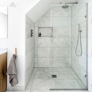 bathroom with shower and glass partition