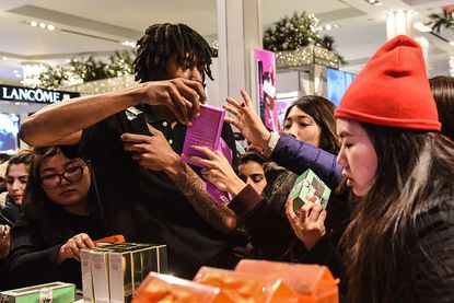Shoppers swarm a Macy's in New York City.