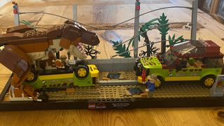 LEGO T. rex Breakout set on a wooden table