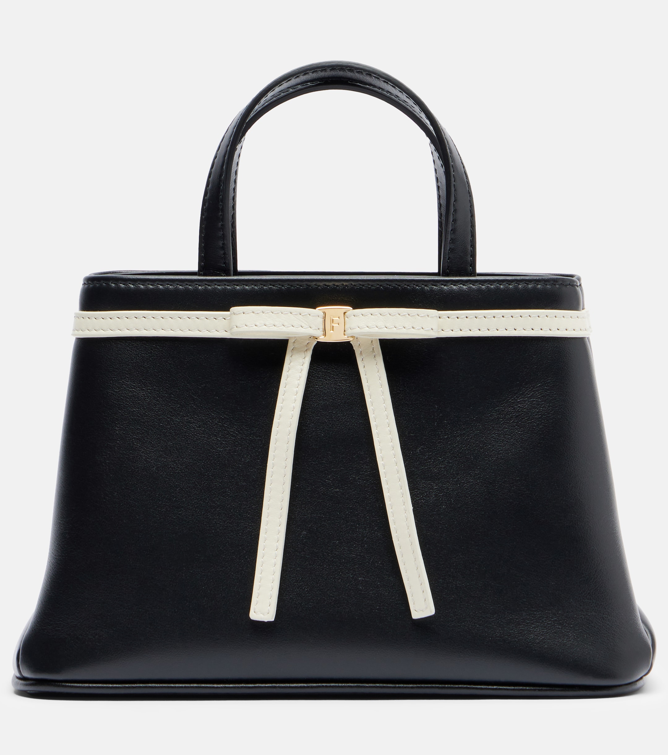 a black and white leather bow bag from ferragamo