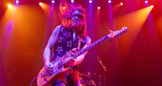In this live shot, Nuno Bettencourt, bathed in red light, shreds on his N4 S-style