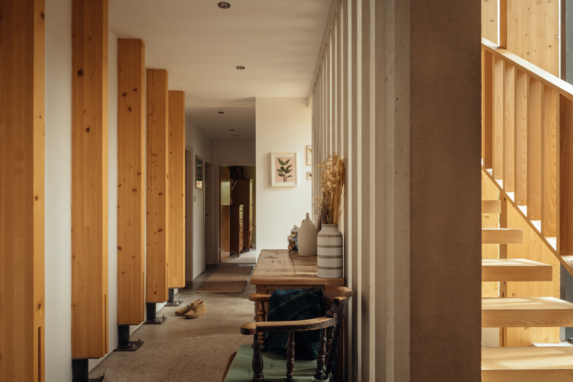 The staircase forms the core of the house, linking the two cubic elements