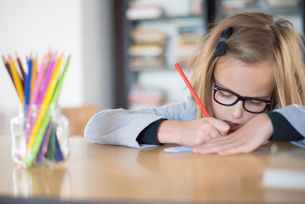 young girl doing homework.