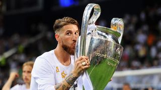 Sergio Ramos kisses the Champions League trophy after Real Madrid's win on penalties in the final against Atletico in 2016.