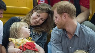 Prince Harry pulls faces with a young fan at the Invictus Games