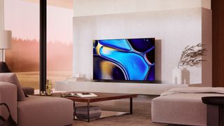Sony Bravia 8 in a modern living room with beige furniture and a wooden coffee table