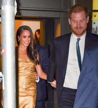 Prince Harry and Meghan Markle leaving an awards ceremony