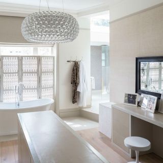 bathroom with dressing room and zoomer lights