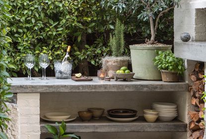 small outdoor bar in an urban backyard with slate grey top