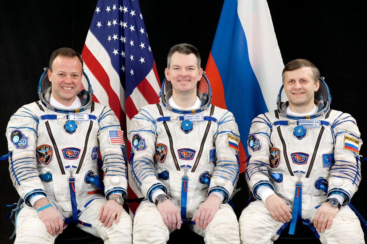 NASA astronaut Ron Garan (left) and Russian cosmonauts Alexander Samokutyaevn (center) and Andrey Borisenko post for a crew photo while clad in Russian Sokol spacesuits.The crew will launch on the Soyuz TMA-21 spacecraft to visit the International Space S