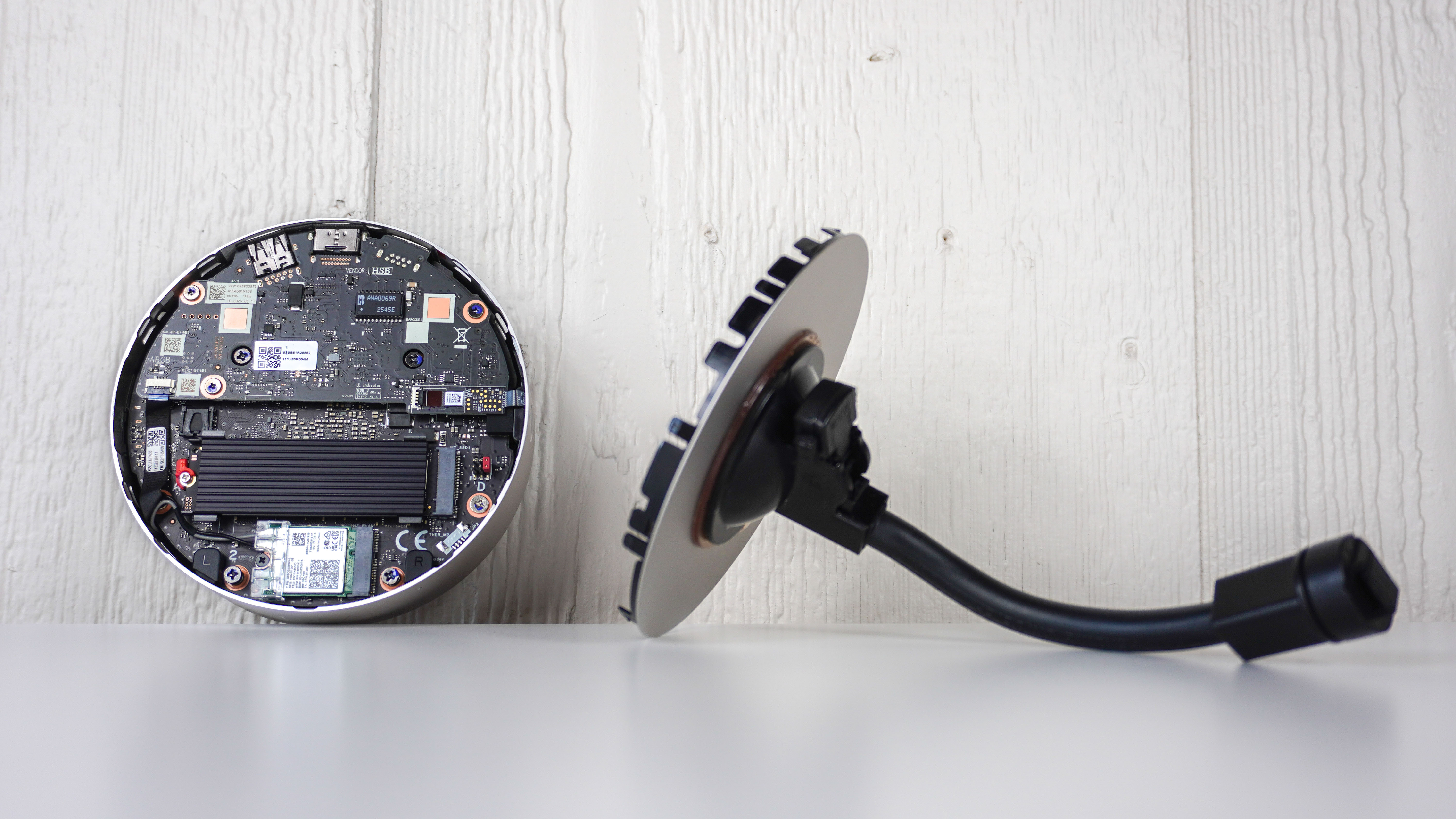 The Lenovo Yoga Mini mini PC with its case opened on a table