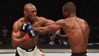 Leon Edwards punches Kamaru Usman in their welterweight bout during the UFC Fight Night event at the Amway Center on December 19, 2015 